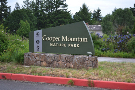 Entrance sign to Cooper Mountain Nature Park from the street